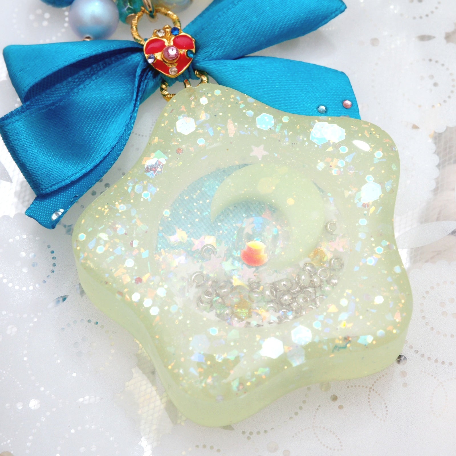 Spinning Orgel Charm (Teal Ribbon)