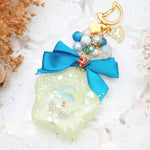 Spinning Orgel Charm (Teal Ribbon)