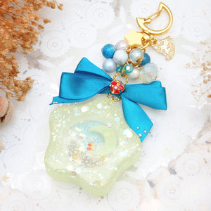 Spinning Orgel Charm (Teal Ribbon)