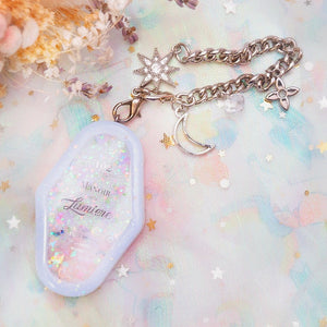 Manoir de la Lumiere Charm (White background, lavender frame)