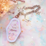 Manoir de la Lumiere Charm (White background, lavender frame)
