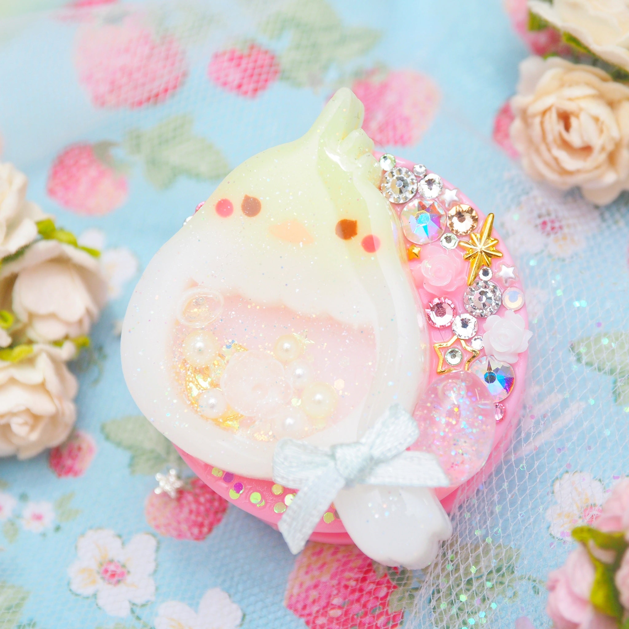 Baby Cockatiel with shaker egg on Pink Grip