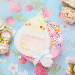 Baby Cockatiel with shaker egg on Pink Grip