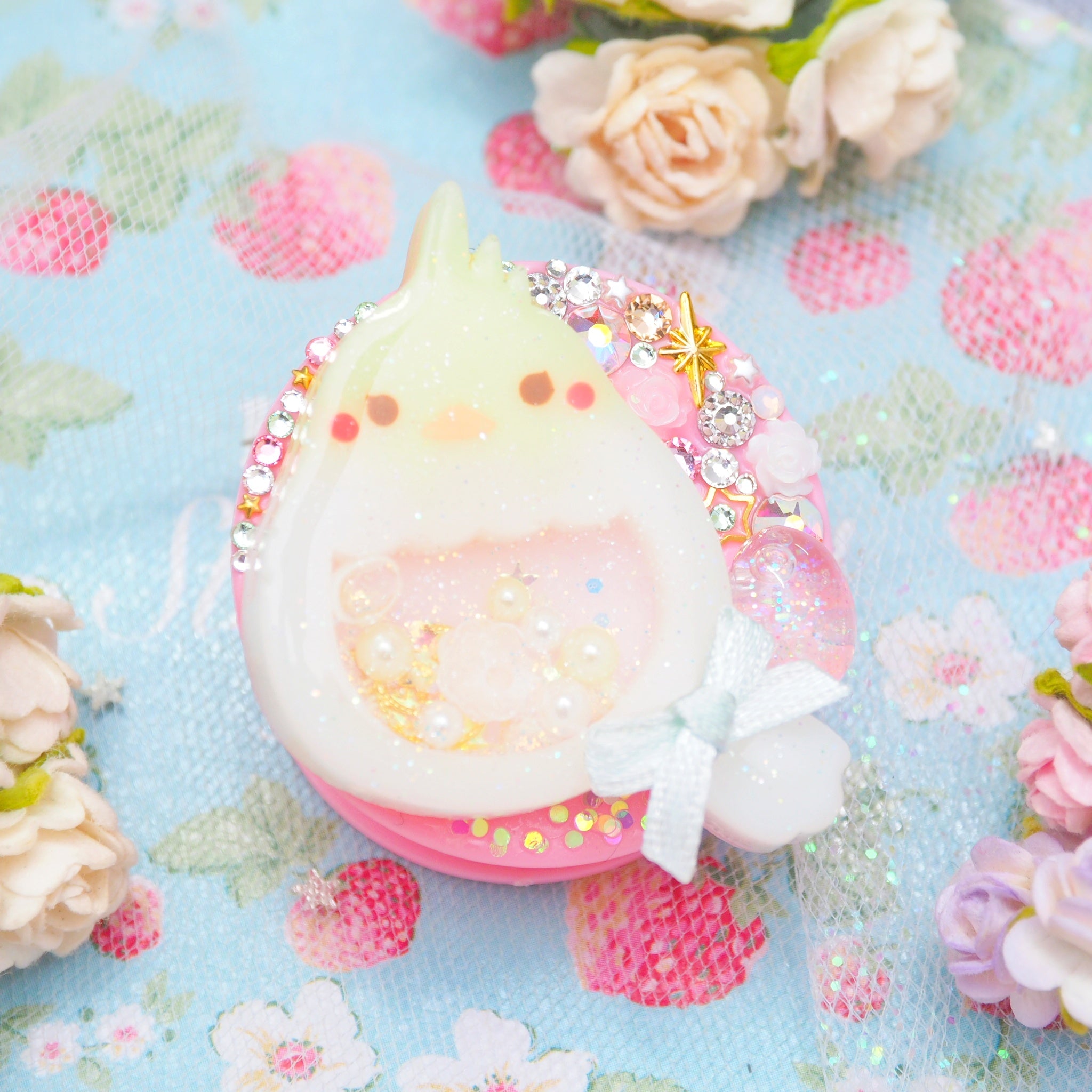 Baby Cockatiel with shaker egg on Pink Grip