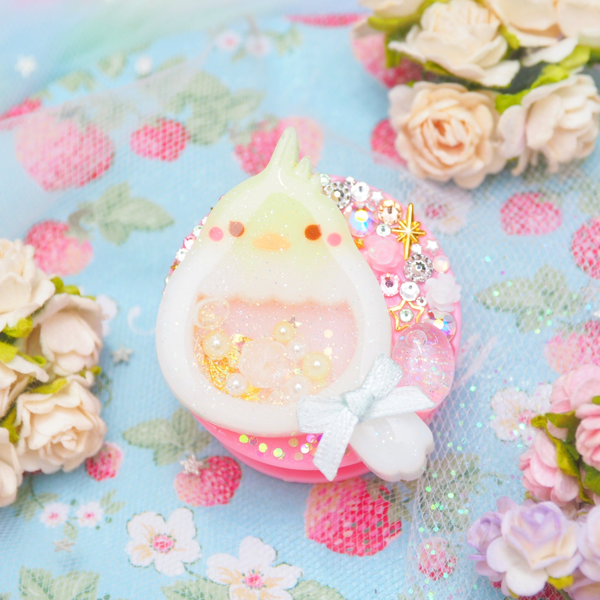Baby Cockatiel with shaker egg on Pink Grip