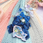 Opulent Orca Ribbon Cascade Charm - Ultraviolet